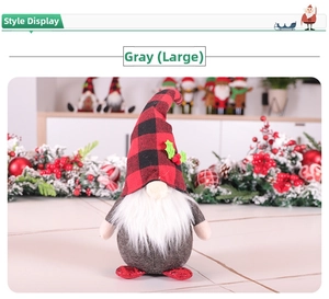 Detail of gray Christmas gnome doll featuring red plaid hat and green holly leaf accents