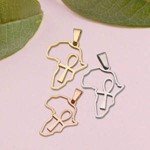 Detail of Ankh symbol and Africa map pendants in gold, silver, and rose gold finishes