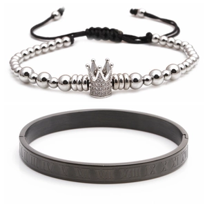 Detail view of silver crown charm bead bracelet and black Roman numeral cuff set