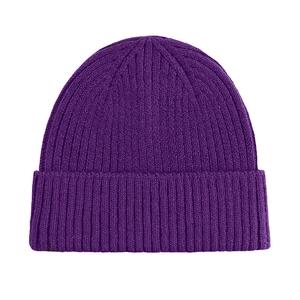 Detailed view of dark purple knit beanie showing fine ribbed texture and warm material