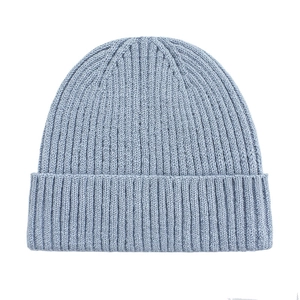 Detailed view of the light blue ribbed knit texture and folded cuff of the beanie hat