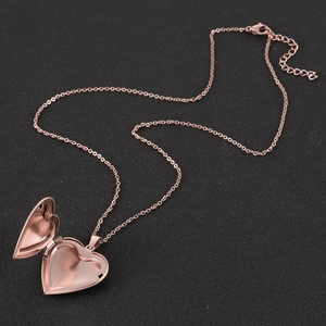 Close-up of open heart locket pendant in rose gold finish for DIY photo jewelry