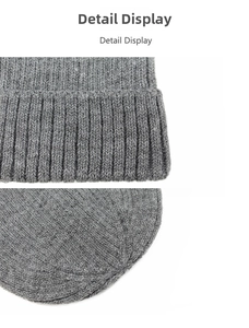 Detail view of the thick ribbed knit texture and stitching on this dark grey beanie