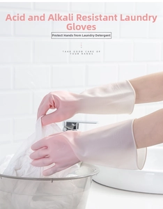 Detailed view of pink waterproof latex gloves for housework against a clean sink backdrop