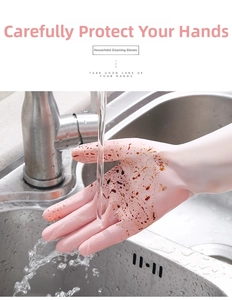 Detail of pink latex kitchen gloves showing anti-slip texture during water dishwashing