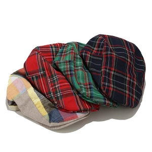 Classic British plaid newsboy caps in red, green, blue, and multicolor patchwork style