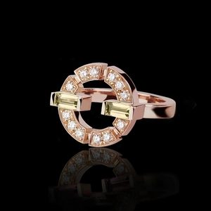 Rose gold interlocking geometric ring with emerald cut yellow stones and round diamonds