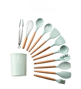 Detailed set of 12 light green silicone kitchen utensils with wooden handles and a holder