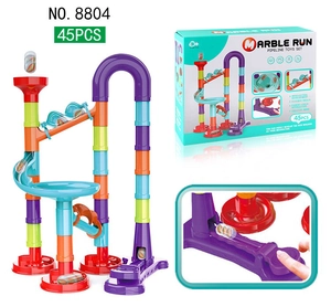 Close-up of marble run toy launcher and 45-piece colorful block building set packaging