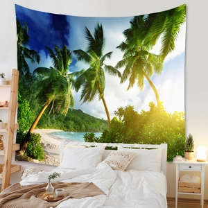 Detail view of tropical beach tapestry with palm trees hanging over a modern bed headboard