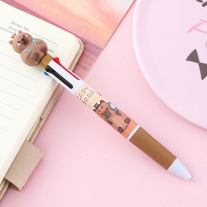 Cute Capybara 4-color retractable ballpoint pen with 3D soft rubber mascot on pastel desk