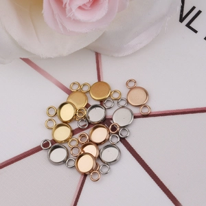 Close-up of circular stainless steel jewelry trays in gold, silver and rose gold