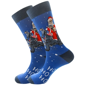 Detailed view of blue cotton crew socks featuring pixel art Santa on a motorcycle with flag