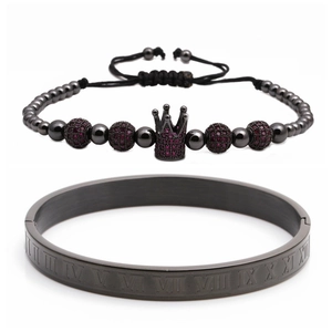 Detail of Roman numeral stainless steel bangle and black crown bead bracelet set