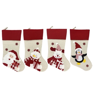 Set of 4 Christmas stockings with Santa, Snowman, Reindeer, and Penguin patterns