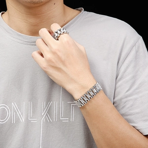 Close-up of men's silver link ring and bracelet set with pave-set clear zircons