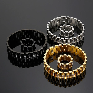 Detailed view of rhinestone-inlaid watchband style bracelets and rings in three colors
