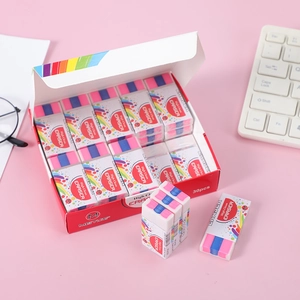 Close-up of 30pcs box of high clean erasers for students on a pink desk background