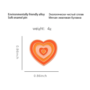 Rainbow gradient heart enamel pin in orange tones made of eco-friendly alloy