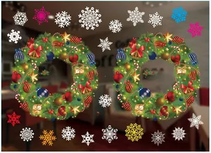 Detail view of colorful Christmas window stickers with wreaths and snowflakes patterns