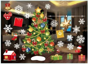 Detailed view of Christmas window stickers with a festive tree, snowflakes and gift boxes