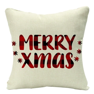 Detail of linen Christmas pillowcase featuring red buffalo plaid Merry Xmas lettering