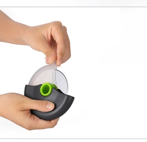 Detail of the PP material transparent protection cover on a round roller pizza cutter tool