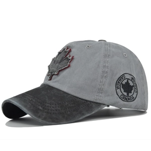 Detail view of distressed cotton baseball cap showing Canada maple leaf embroidery