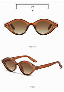 Détail de lunettes de soleil ovales couleur thé avec monture ambre C4 et verres dégradés