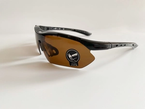 Detail view of streamlined sports sunglasses frame with anti-slip temple ventilation