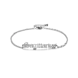 Detailed close-up of Sagittarius gothic pendant on a silver stainless steel anklet chain