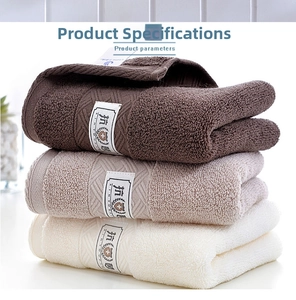 Close-up of stacked cotton towels with antibacterial logo and herringbone weave detail