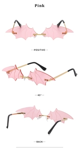 Detailed views of pink bat-shaped rimless sunglasses with gold metal frame