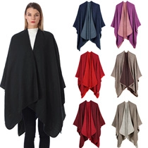 Detailed view of women's turtleneck poncho sweater in various plaid color options