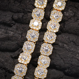 Macro shot of gold hip hop chain with square links and clear cubic zirconia gemstones