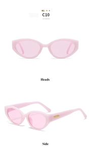 Détail de lunettes de soleil œil de chat roses avec accents métalliques dorés