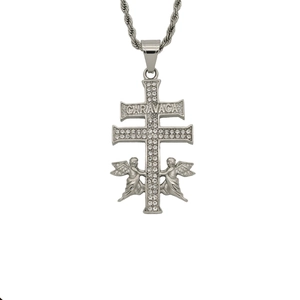 Detailed view of silver Caravaca cross necklace with crystal pavé and two winged angels