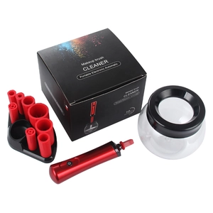 Detail of electric makeup brush cleaner kit with red silicone adapters and drying bowl