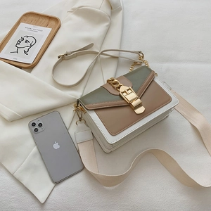 Chic color-block crossbody bag in green and beige with gold chain and wide strap