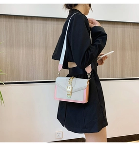 Fashionable color-block crossbody bag with gold chain and wide shoulder strap