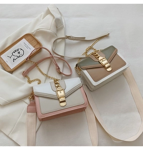 Flat lay of stylish PU leather crossbody bags in pink and green colorblock designs