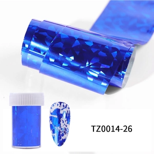 Detail of blue holographic nail foil with shimmering starry sky pattern and storage bottle