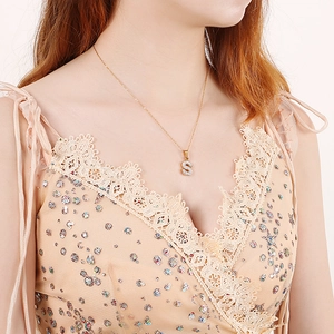 Gold plated stainless steel letter S pendant necklace with shimmering pave crystals