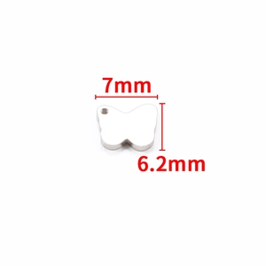 Macro view of 7mm butterfly shaped stainless steel pendant charm with size annotations