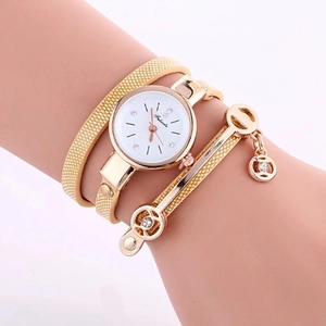 Women's gold quartz watch with wrap-around mesh band and rhinestone dial details
