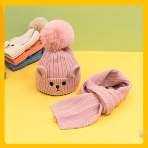 Pink winter knit hat and scarf set for toddlers with bear embroidery and pom poms