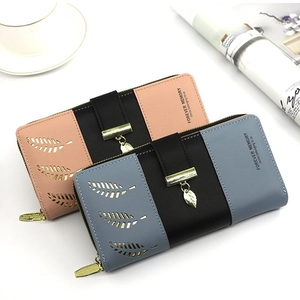 Women's long bifold wallet featuring hollow leaf design and patchwork color contrast detail