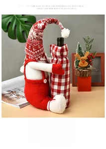 Detail of Christmas gnome wine bottle cover with red knit elk hat and felt suspender pants