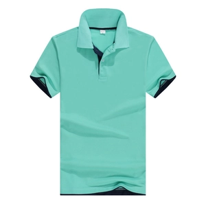 Detailed view of mint green polo shirt featuring navy blue contrast trim on the collar