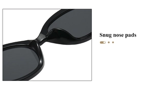 Détail des lunettes de soleil œil-de-chat noires avec plaquettes de nez intégrées